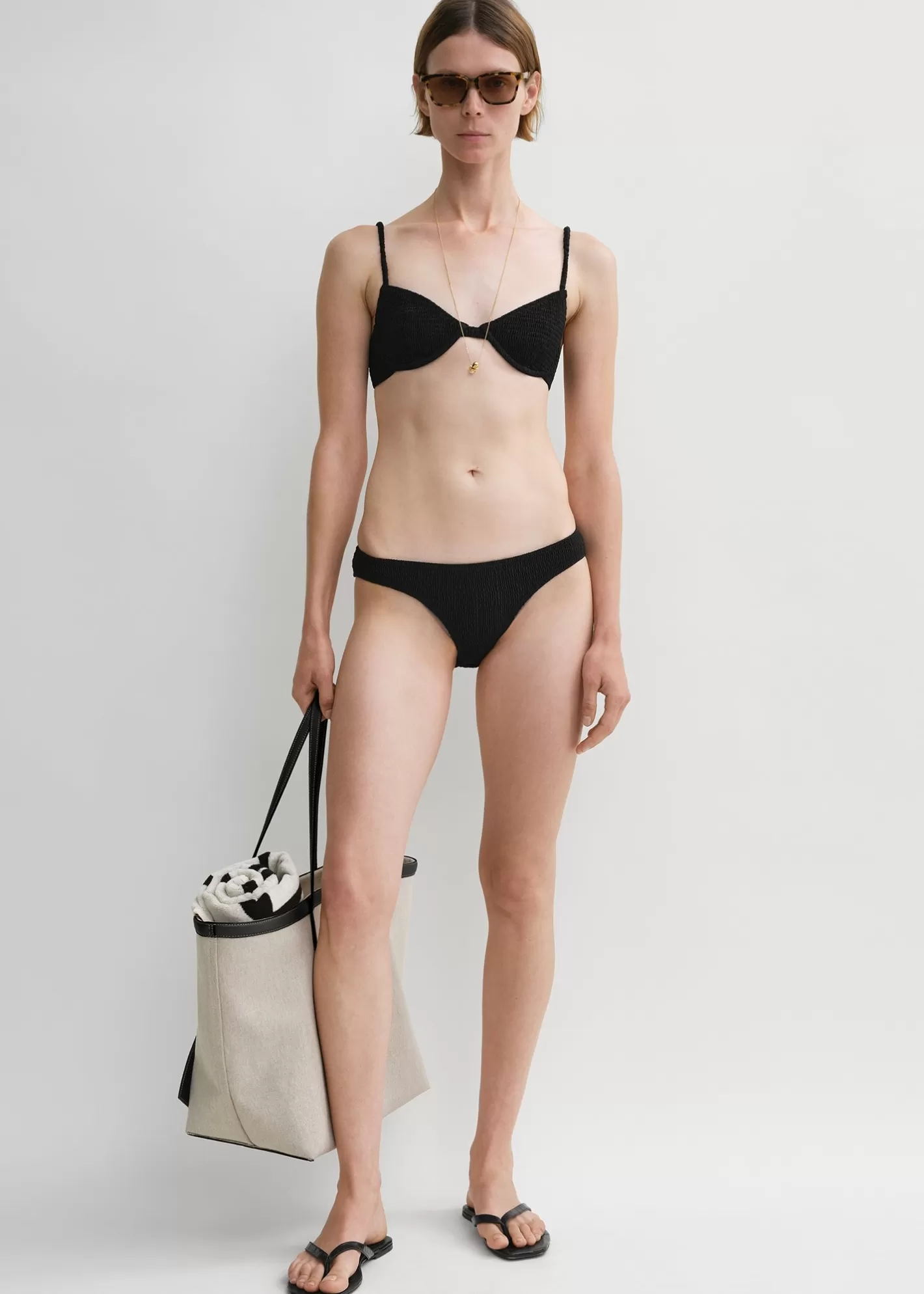 Swim>TOTEME Smocked half-cup bikini top Black