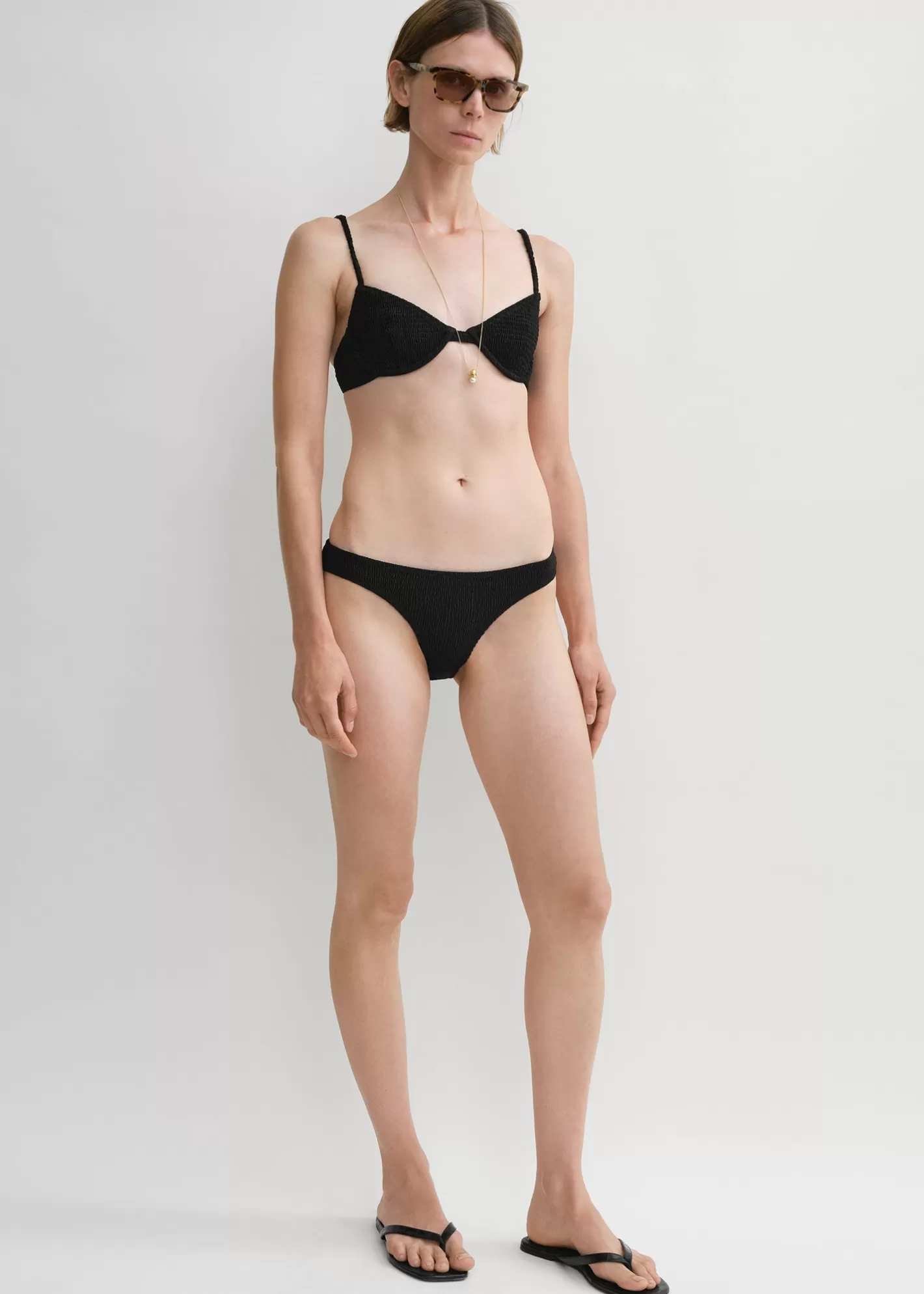 Swim>TOTEME Smocked mid-rise bikini bottoms Black